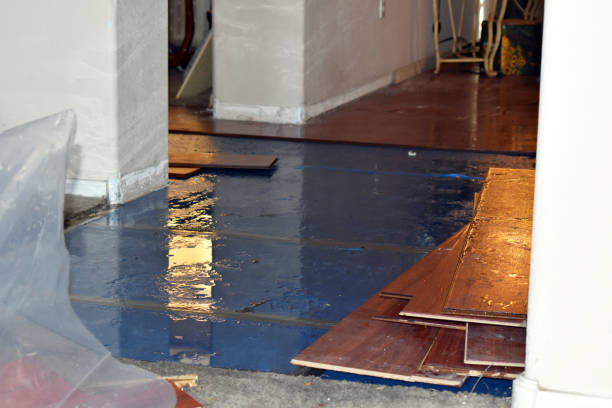 Professional Emergency Water Damage Restoration technician working in Melville, RI